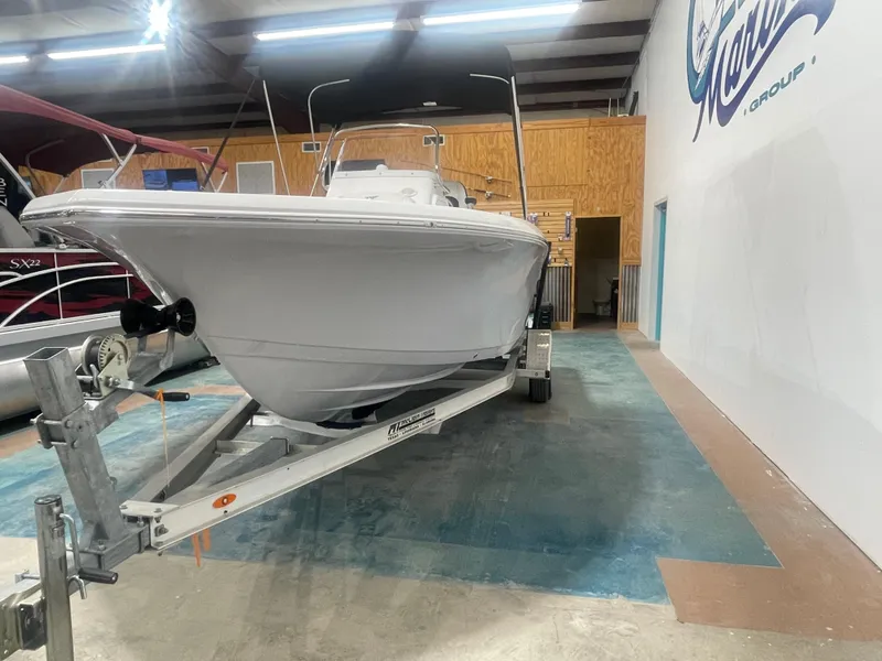 Slide: The Image of 2025 Tidewater 198CC boat on trailer in showroom. - 9