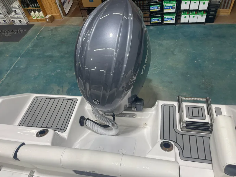 Slide: The Image of 2025 Tidewater 210LXF boat with Yamaha outboard motor in showroom. - 15