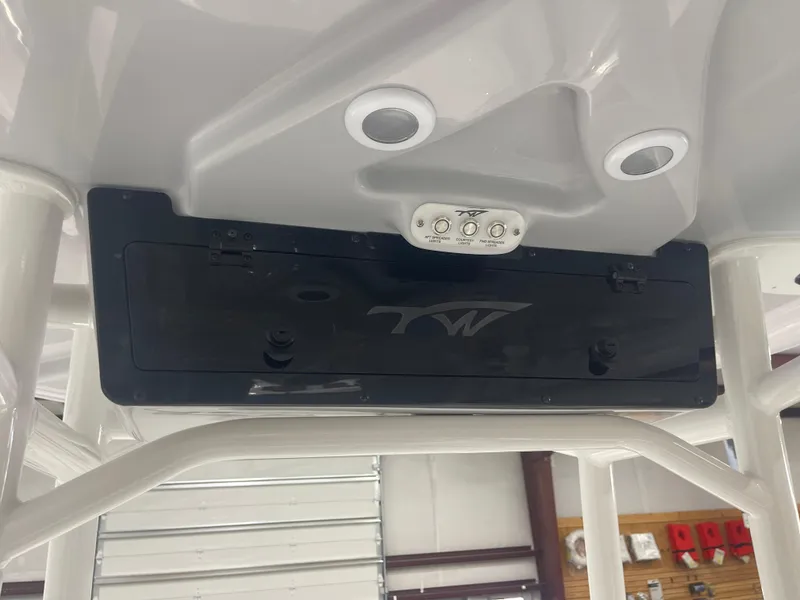 Slide: The Image of 2025 Tidewater 210LXF boat console with controls and speakers. - 21