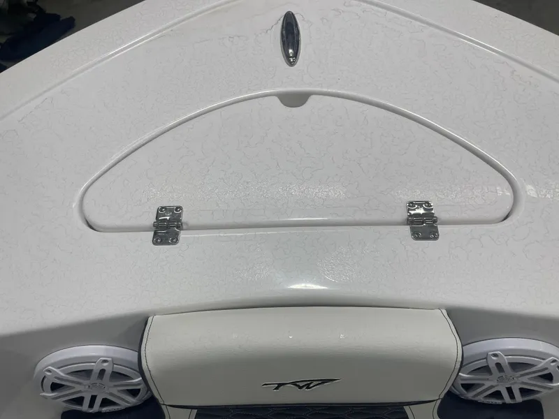 Slide: The Image of 2025 Tidewater 210LXF boat deck with storage hatch and speakers. - 25