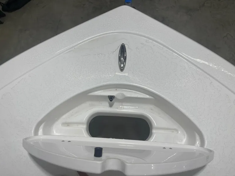 Slide: The Image of 2025 Tidewater 210LXF boat bow with anchor storage compartment. - 26