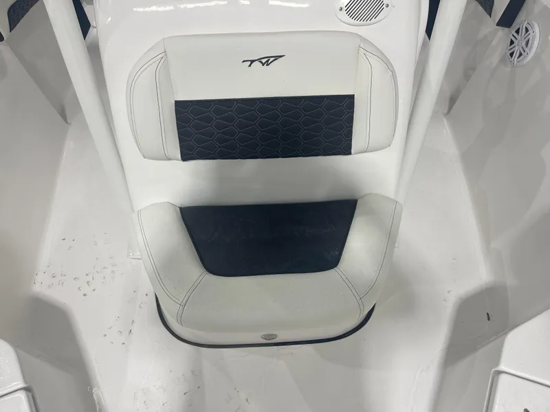 Slide: The Image of 2025 Tidewater 210LXF boat seat with black and white upholstery. - 27