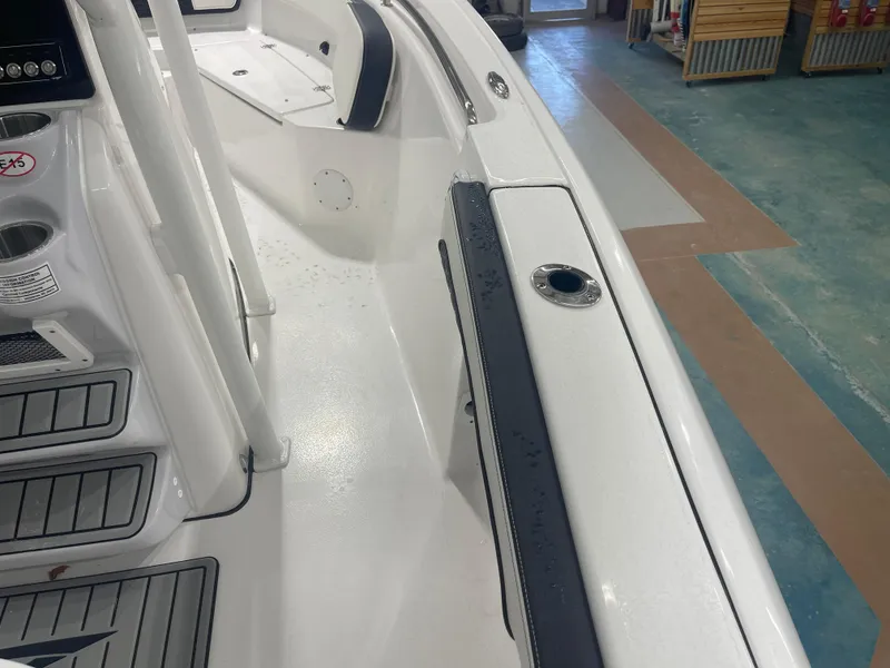 Slide: The Image of 2025 Tidewater 210LXF boat interior, featuring sleek white design and modern fittings. - 30