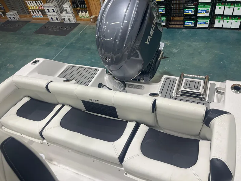 Slide: The Image of 2025 Tidewater 210LXF boat interior with Yamaha engine and seating. - 34