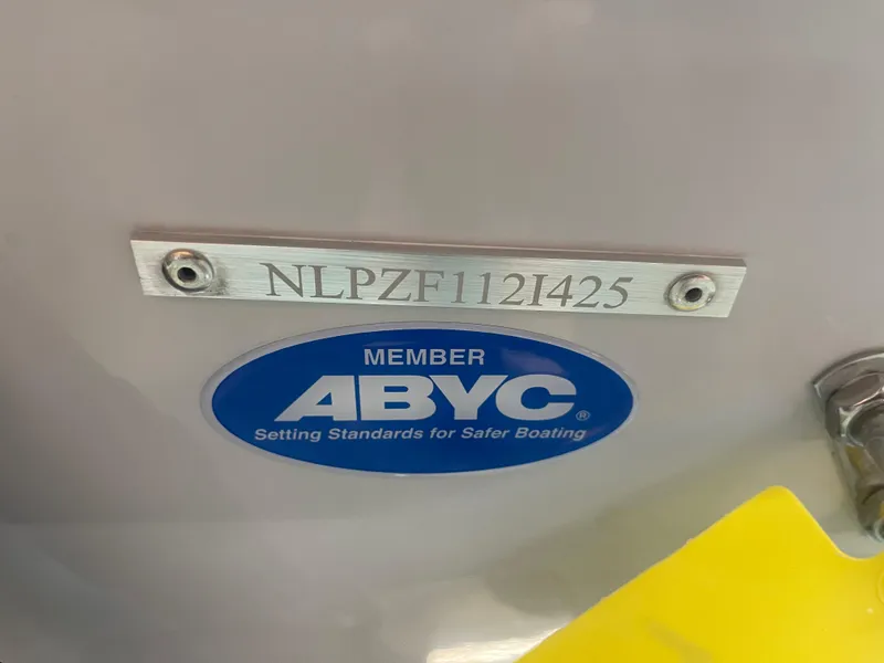 Slide: The Image of 2025 Tidewater 210LXF boat with ABYC membership plaque and serial number. - 35