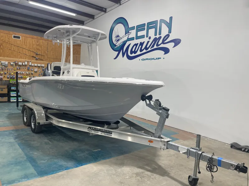 Slide: The Image of 2025 Tidewater 210LXF boat on trailer at Ocean Marine Group showroom. - 5