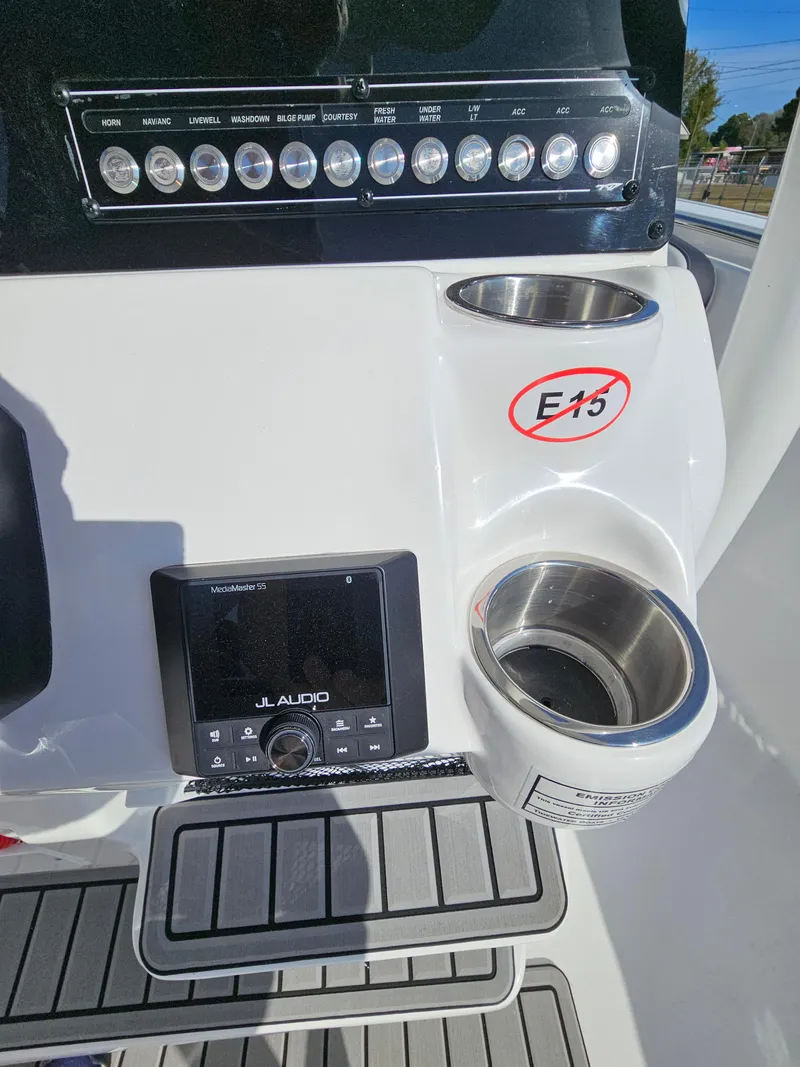 Slide: The Image of 2025 Tidewater 220LXF boat dashboard with JL Audio system and control panel. - 15