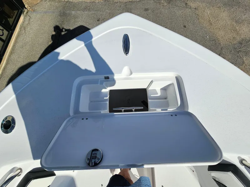 Slide: The Image of 2025 Tidewater 220LXF boat deck with open storage compartment. - 22