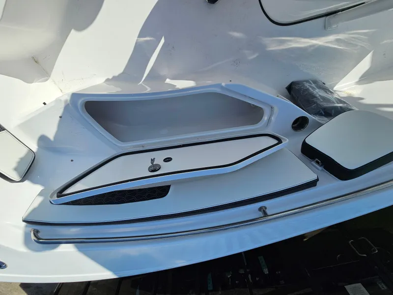 Slide: The Image of 2025 Tidewater 220LXF boat interior storage compartment with sleek design and modern features. - 28