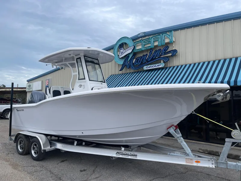 Slide: The Image of 2025 Tidewater 232cc boat on trailer at Ocean Marine Group dealership. - 3