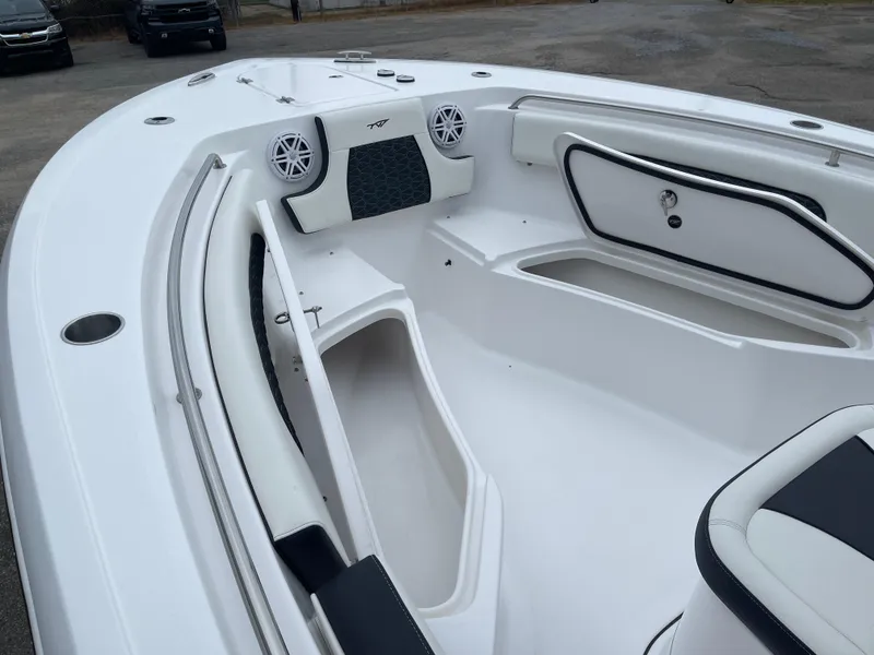 Slide: The Image of 2025 Tidewater 232cc boat interior with storage compartments and seating. - 30