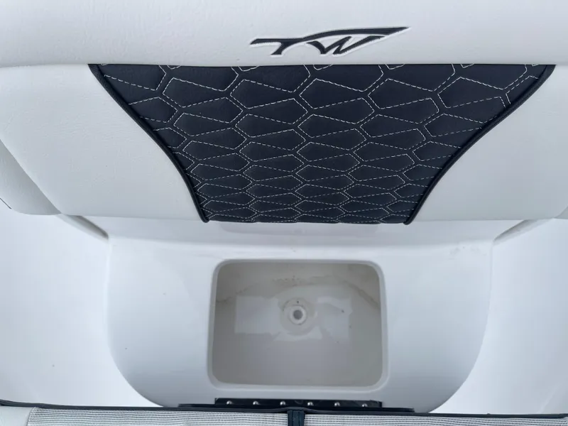Slide: The Image of Tidewater 232cc 2025 boat interior with storage compartment and stylish stitching. - 32