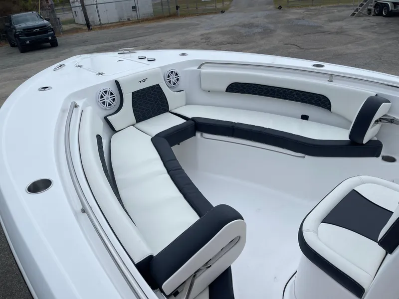 Slide: The Image of 2025 Tidewater 232cc boat interior with white and black seating. - 35