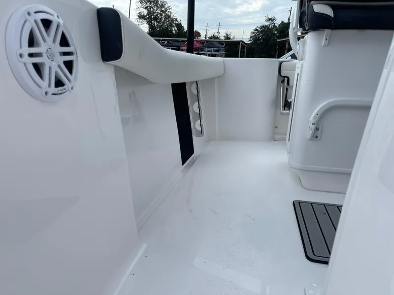 Slide: The Image of 2025 Tidewater 232cc boat interior with speaker and seating. - 40