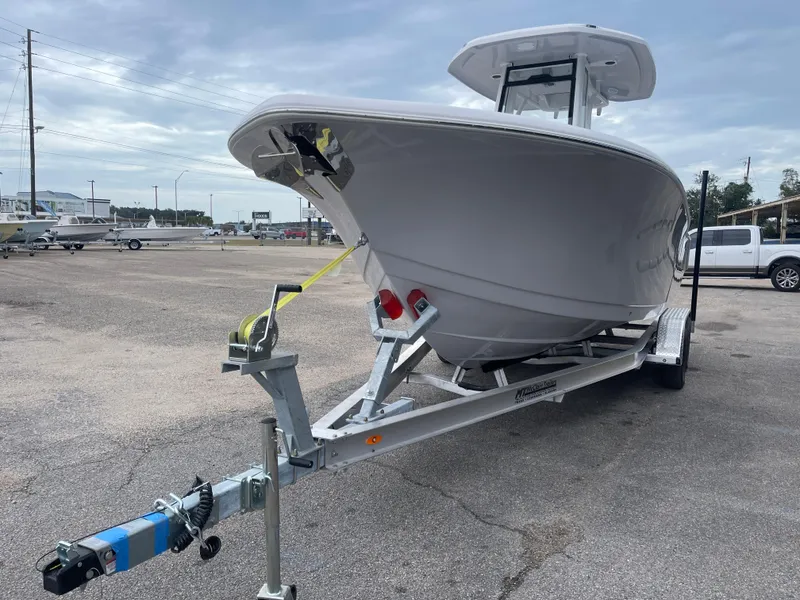 Slide: The Image of 2025 Tidewater 232cc boat on trailer in parking lot. - 6