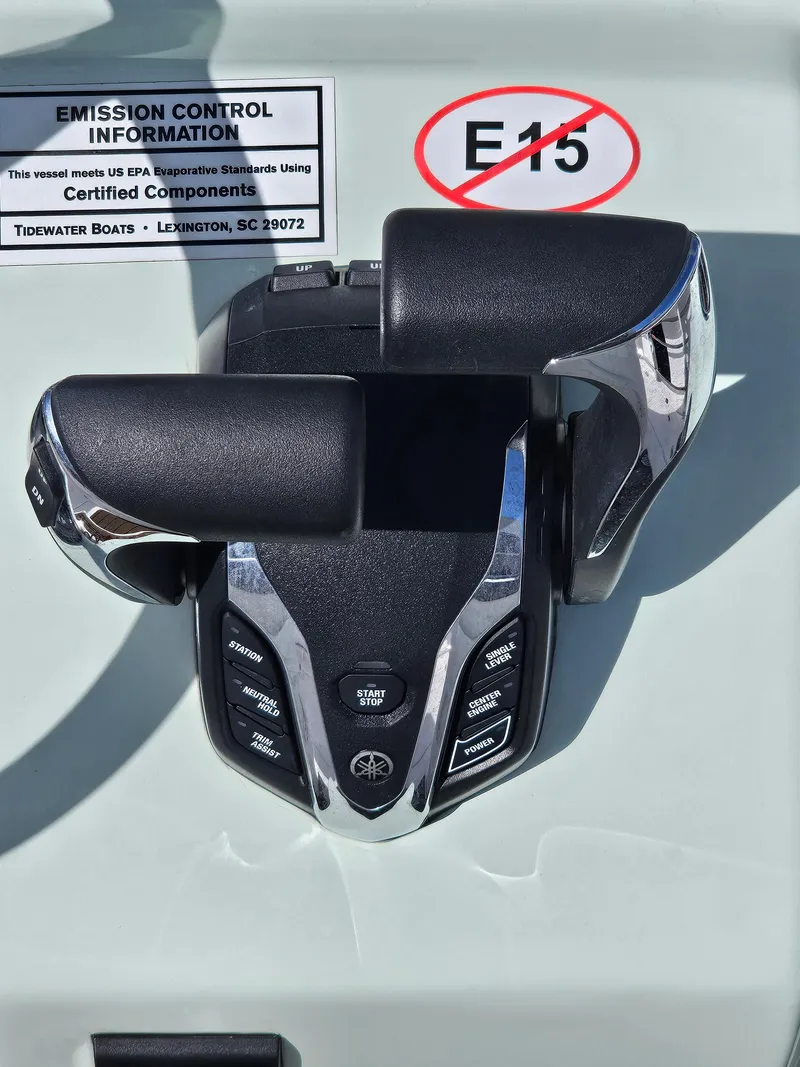 Slide: The Image of 2024 Tidewater 272cc boat controls with E15 fuel warning label. - 17