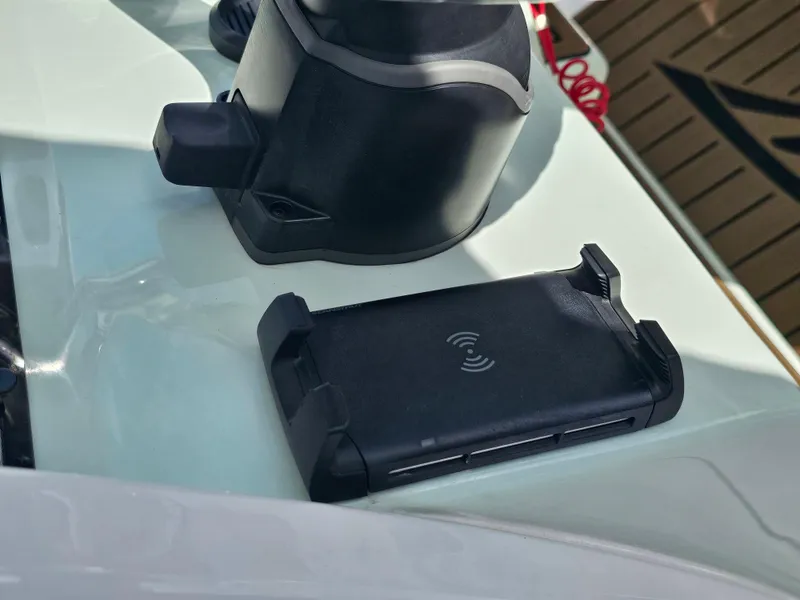 Slide: The Image of 2024 Tidewater 272cc boat console with wireless charging pad. - 18