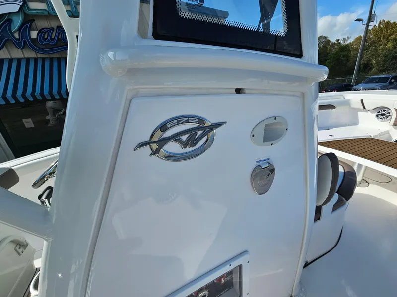 Slide: The Image of 2024 Tidewater 272cc boat interior with logo and fresh water access. - 24