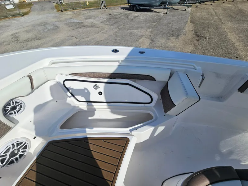 Slide: The Image of 2024 Tidewater 272cc boat interior with seating and speakers. - 26