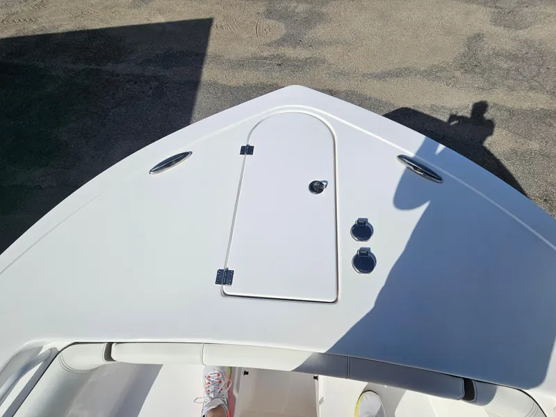 Slide: The Image of 2024 Tidewater 272cc boat deck with storage hatch and fittings. - 29
