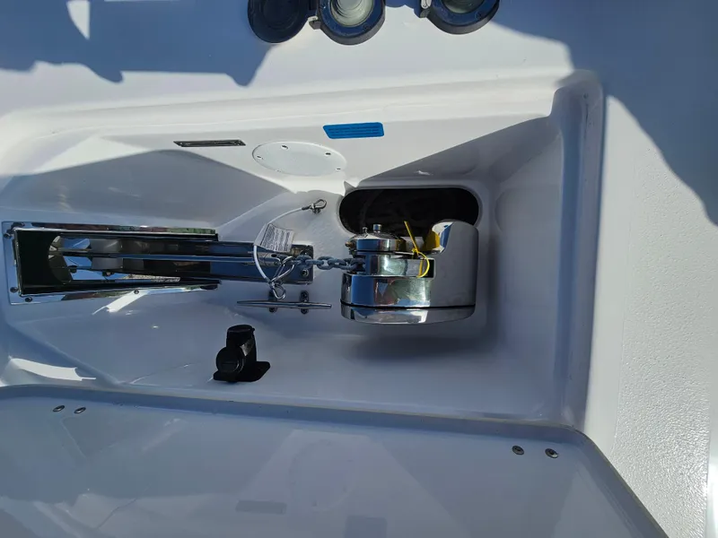 Slide: The Image of Anchor compartment of 2024 Tidewater 272cc boat with chain and winch. - 31