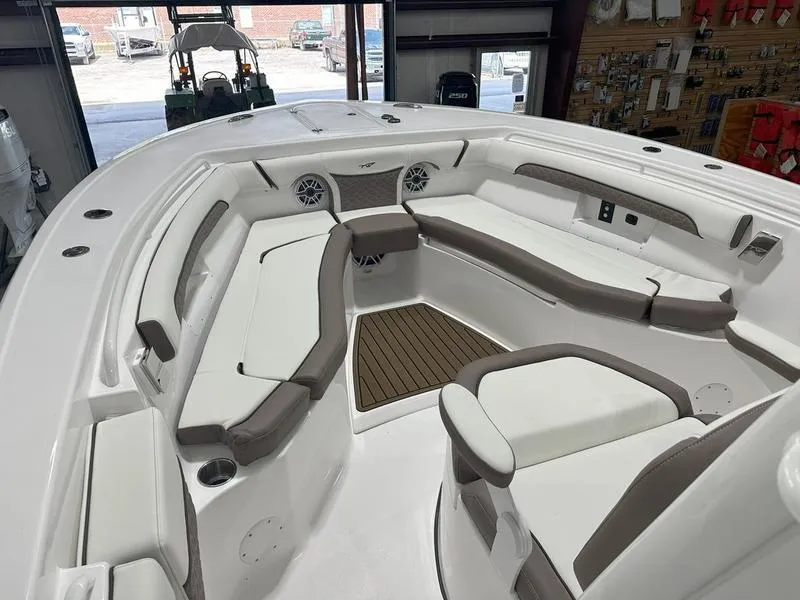 Slide: The Image of 2024 Tidewater 272cc boat interior with cushioned seating and modern design. - 38