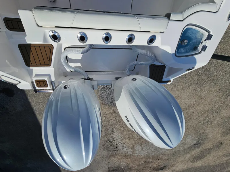 Slide: The Image of 2024 Tidewater 272cc boat with dual outboard engines, top view. - 8