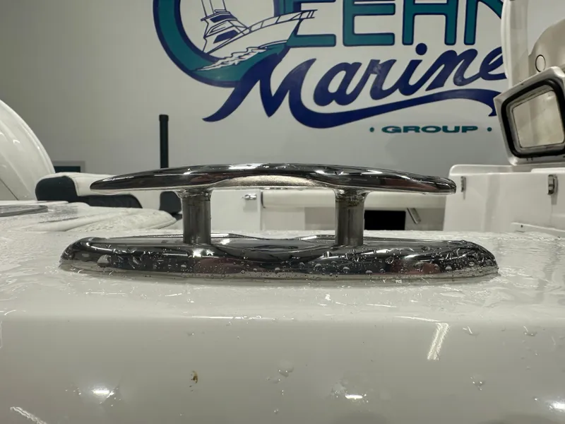Slide: The Image of Close-up of 2024 Tidewater 292CC boat cleat with Ocean Marine Group logo. - 14