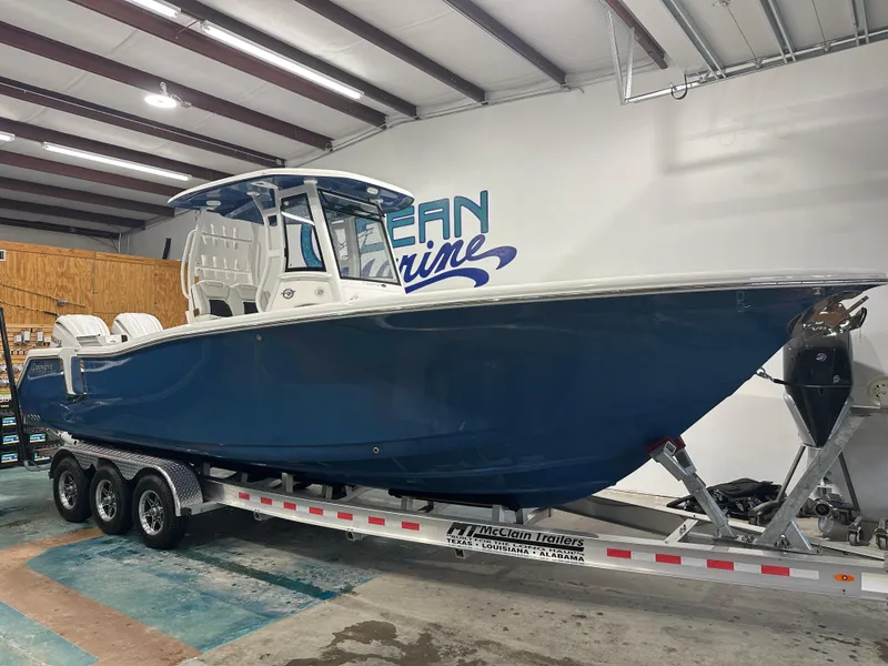 Slide: The Image of 2024 Tidewater 292CC boat on trailer in indoor showroom. - 16
