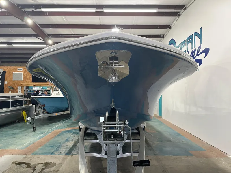 Slide: The Image of 2024 Tidewater 292CC boat in showroom, front view. - 17