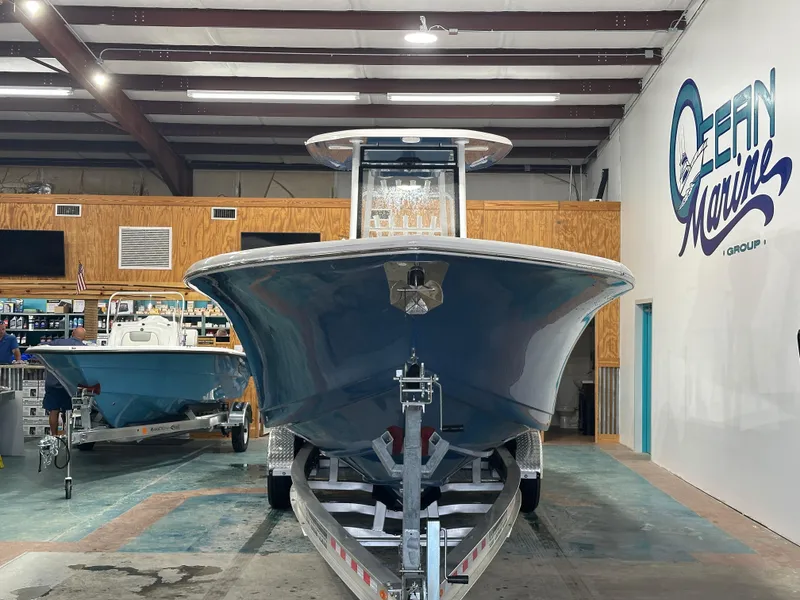 Slide: The Image of 2024 Tidewater 292CC boat on trailer in showroom. - 18