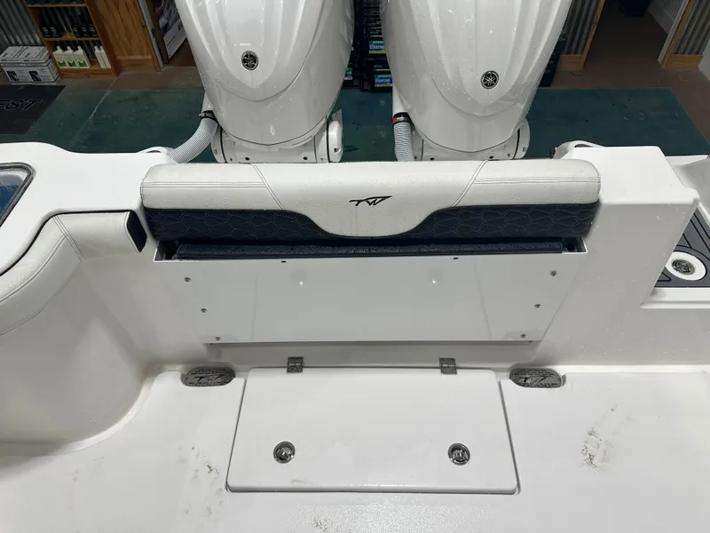 Slide: The Image of 2024 Tidewater 292CC boat interior with dual engines and seating area. - 22