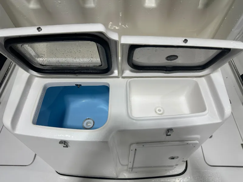 Slide: The Image of 2024 Tidewater 292CC boat livewell and storage compartments. - 24
