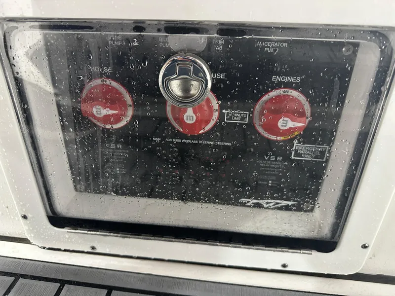 Slide: The Image of Control panel of 2024 Tidewater 292CC boat with water droplets. - 29