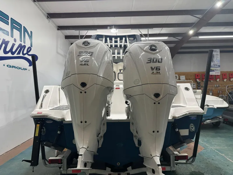 Slide: The Image of 2024 Tidewater 292CC boat with dual 300 V6 engines in showroom. - 3