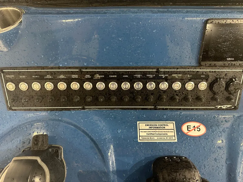 Slide: The Image of Control panel of 2024 Tidewater 292CC boat, featuring various switches and labels. - 30