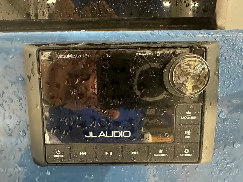 Slide: The Image of JL Audio MediaMaster 105 on 2024 Tidewater 292CC, wet marine stereo system. - 32