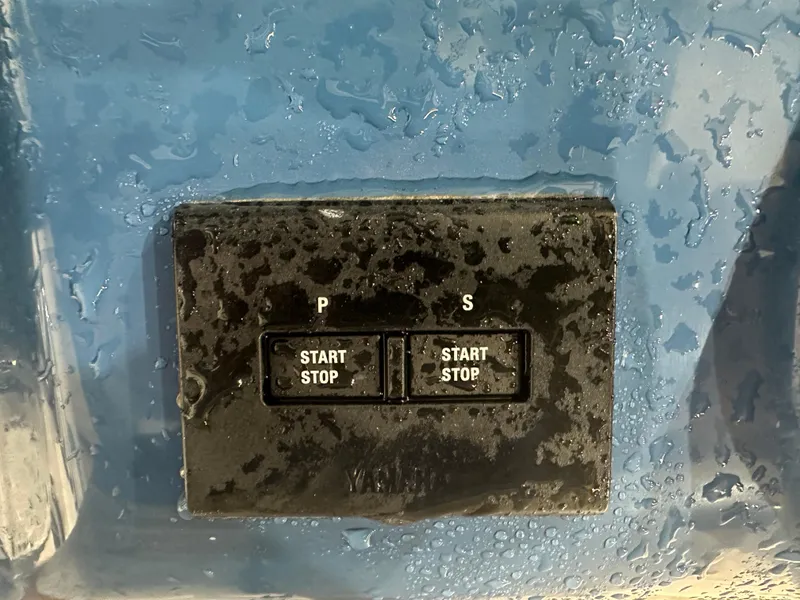 Slide: The Image of Wet control panel on 2024 Tidewater 292CC boat with start/stop buttons. - 33