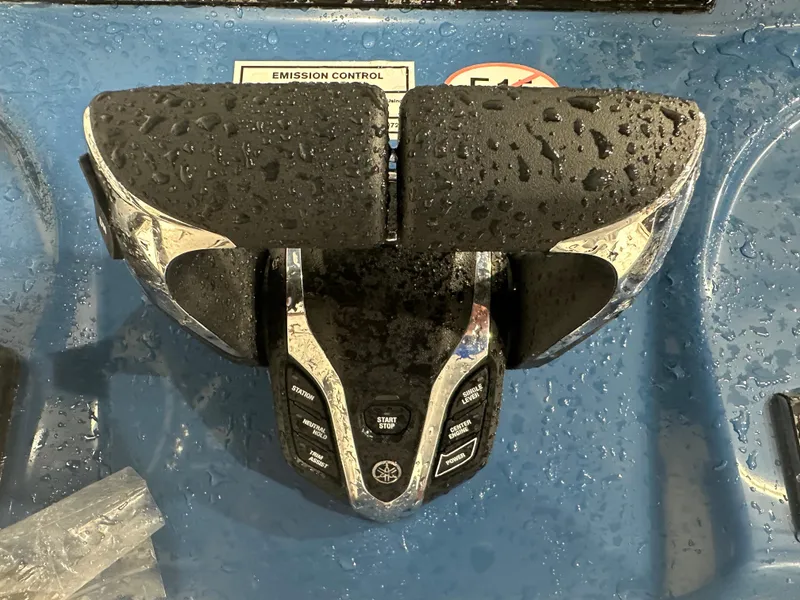 Slide: The Image of Close-up of 2024 Tidewater 292CC boat controls with water droplets. - 34