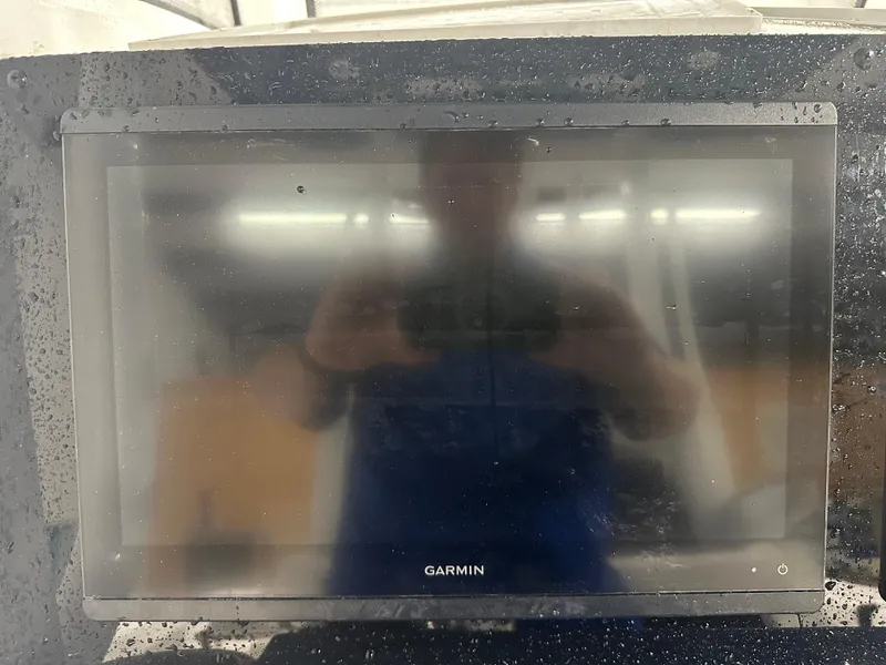 Slide: The Image of Garmin display on 2024 Tidewater 292CC boat, wet with water droplets. - 37