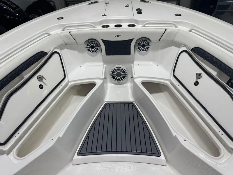 Slide: The Image of 2024 Tidewater 292CC boat interior with storage compartments and speakers. - 41