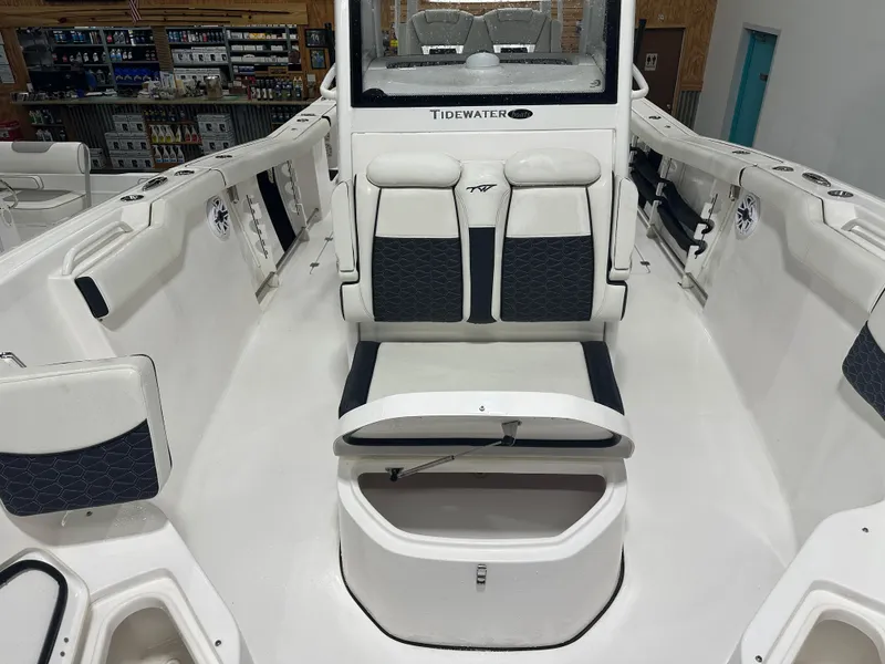 Slide: The Image of 2024 Tidewater 292CC boat interior with seating and storage compartments. - 42