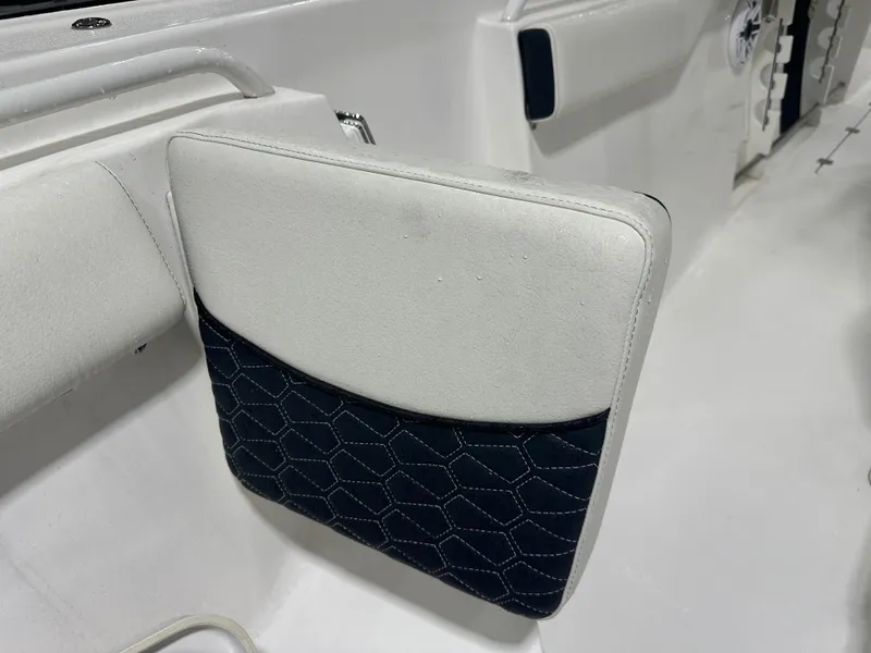 Slide: The Image of 2024 Tidewater 292CC boat seat with white and navy hexagonal pattern upholstery. - 43