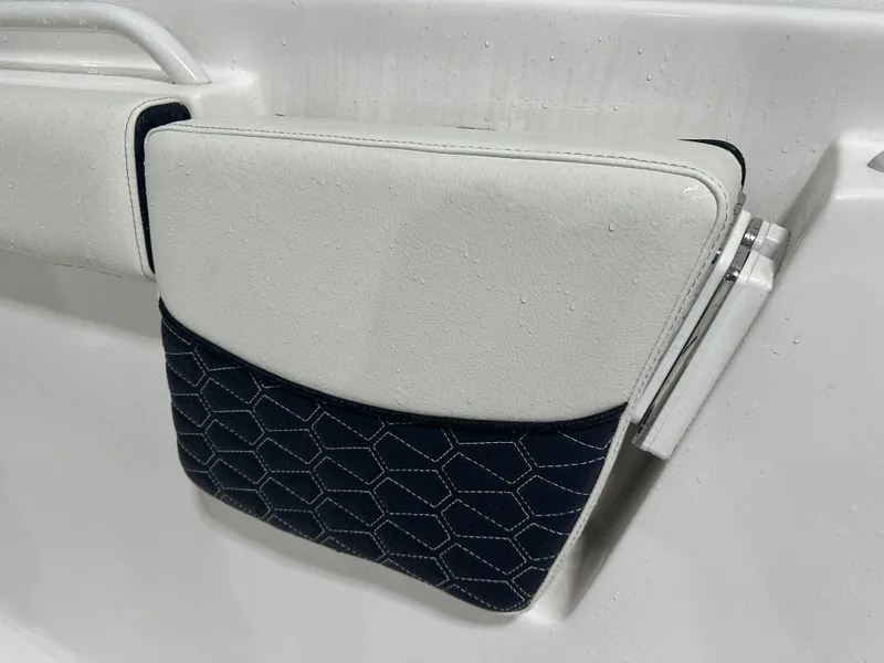 Slide: The Image of 2024 Tidewater 292CC boat seat with hexagonal pattern and wet surface. - 44