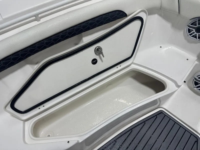 Slide: The Image of 2024 Tidewater 292CC boat storage compartment with sleek design and secure lock. - 45