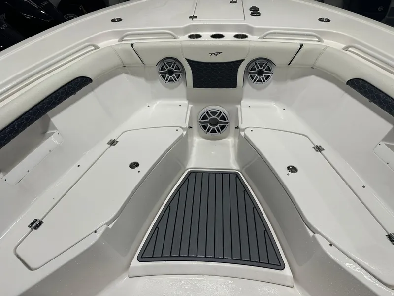 Slide: The Image of 2024 Tidewater 292CC boat interior with seating and speakers. - 48