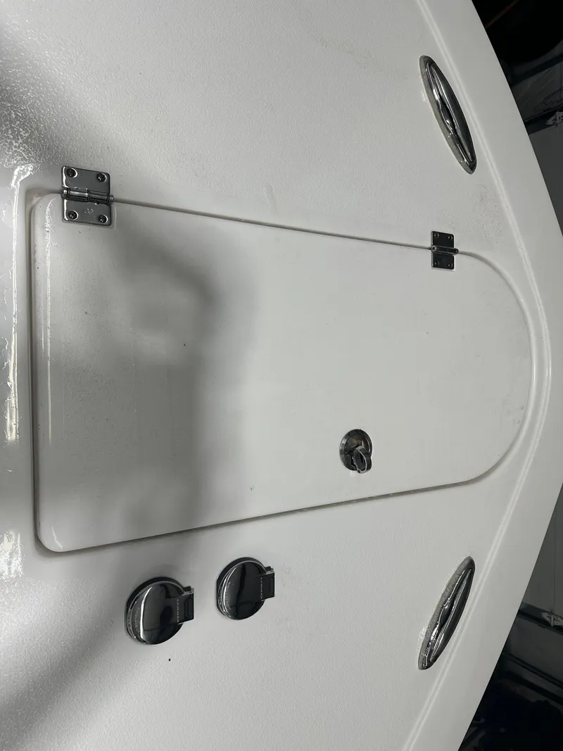 Slide: The Image of 2024 Tidewater 292CC boat deck with hatch and fittings. - 49