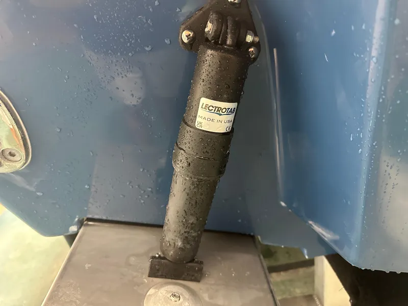 Slide: The Image of Close-up of 2024 Tidewater 292CC boat component with Lectrotab actuator. - 7
