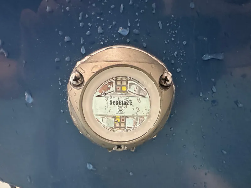 Slide: The Image of Close-up of SeaBlaze underwater light on 2024 Tidewater 292CC boat. - 9