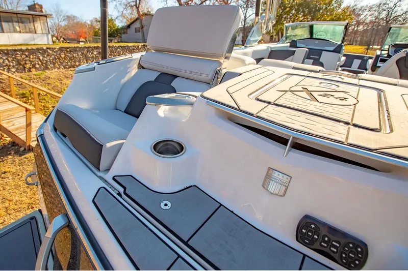 Slide: The Image of 2019 MasterCraft X24 boat interior with luxurious seating and modern design. - 12